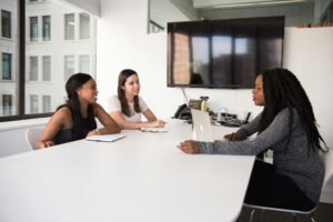 Candidates being interviewed as part of a modern talent acquisition strategy using AI recruitment tools.